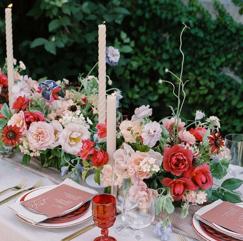 Table setting with pink and red florals and settings. Silk Table Runner by The Lesser Bear Photo by Jenny Haas Florals Old Slate Farm and Styling Auburn and Ivory