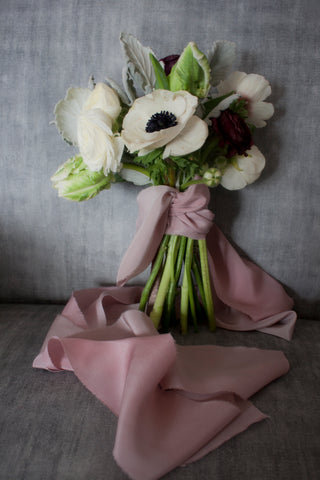 Simple hand tied white floral bouquet with pink silk ribbon by The Lesser Bear