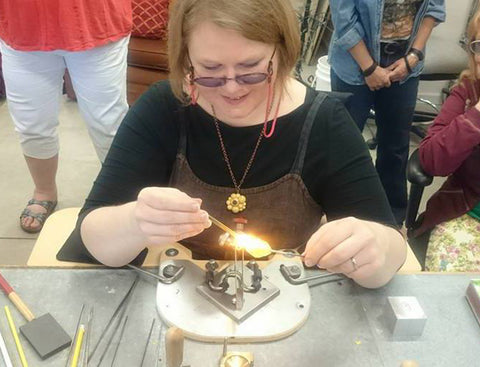 Amy torching during a demo with the Florida Glass Dragons