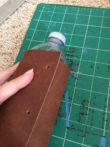Wrap the leather around the water bottle