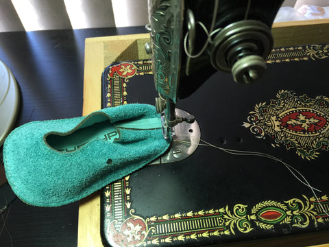 stitching leather on a vintage singer 66 sewing machine