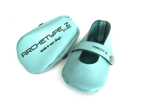 blue leather shoes with archetype z logo