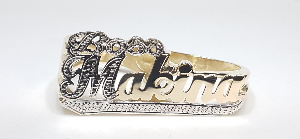 Custom made Boss Makina two finger name ring in 14 karat yellow gold two tone with high polish and white bead work