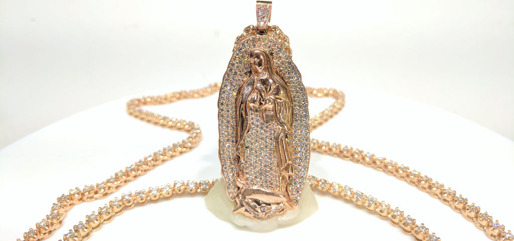 In the center: a custom made 14 karat rose gold pave set diamond Saint Mary Guadalupe Pendant with a prong set diamond tennis necklace in 14 karat rose gold made by Popular Jewelry in New York