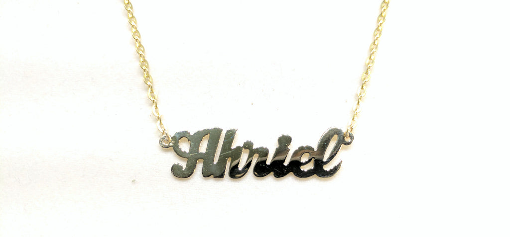In the center: a custom made name plate rolo necklace for Ahriel in script 14 karat yellow gold and high polish finish by Popular Jewelry