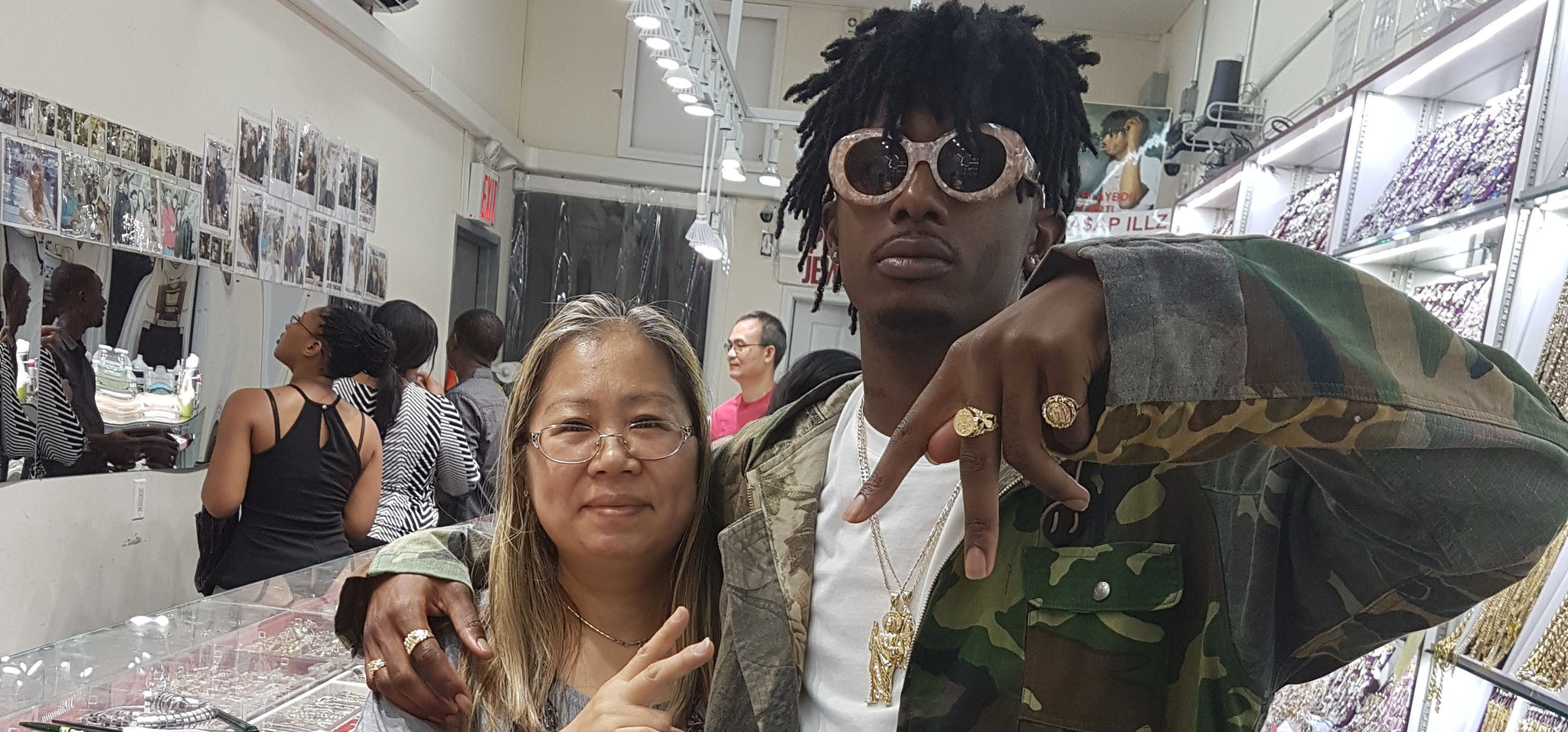 Playboi Carti who is a rapper from from Atlanta, Georgia who signed with Awful Records. In this picture he is on the right posing with ASAP Eva who is on the left at Popular Jewelry