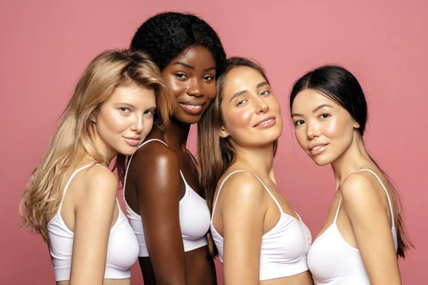 Group of women wearing matching tops and smiling