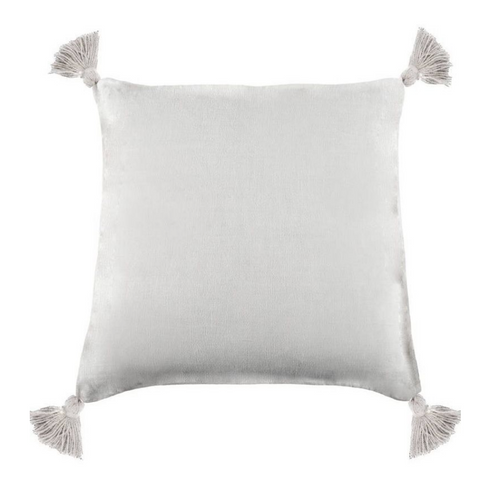 A white pillow with tassels on each corner