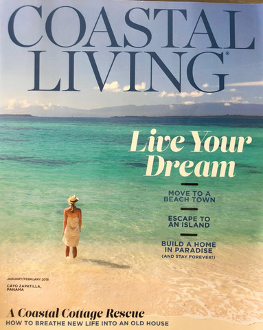 Coastal Living Magazine cover, a woman standing on the beach in the ocean
