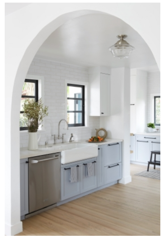 a bright kitchen with a lovely arch ceiling