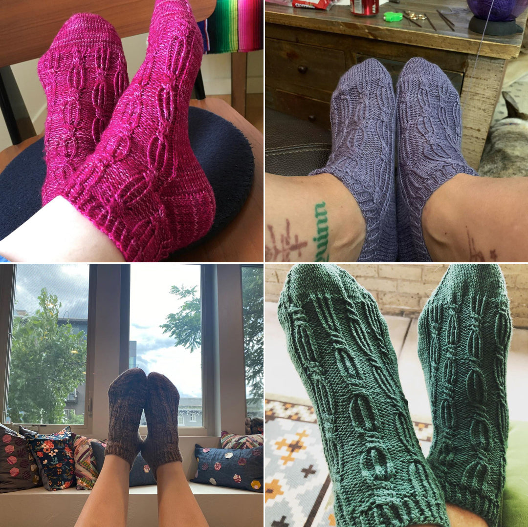 A square image showing 4 different socks that are knitted.