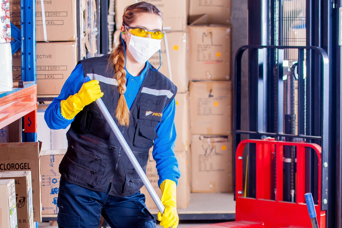 warehouse staff in protective clothing for coronavirus