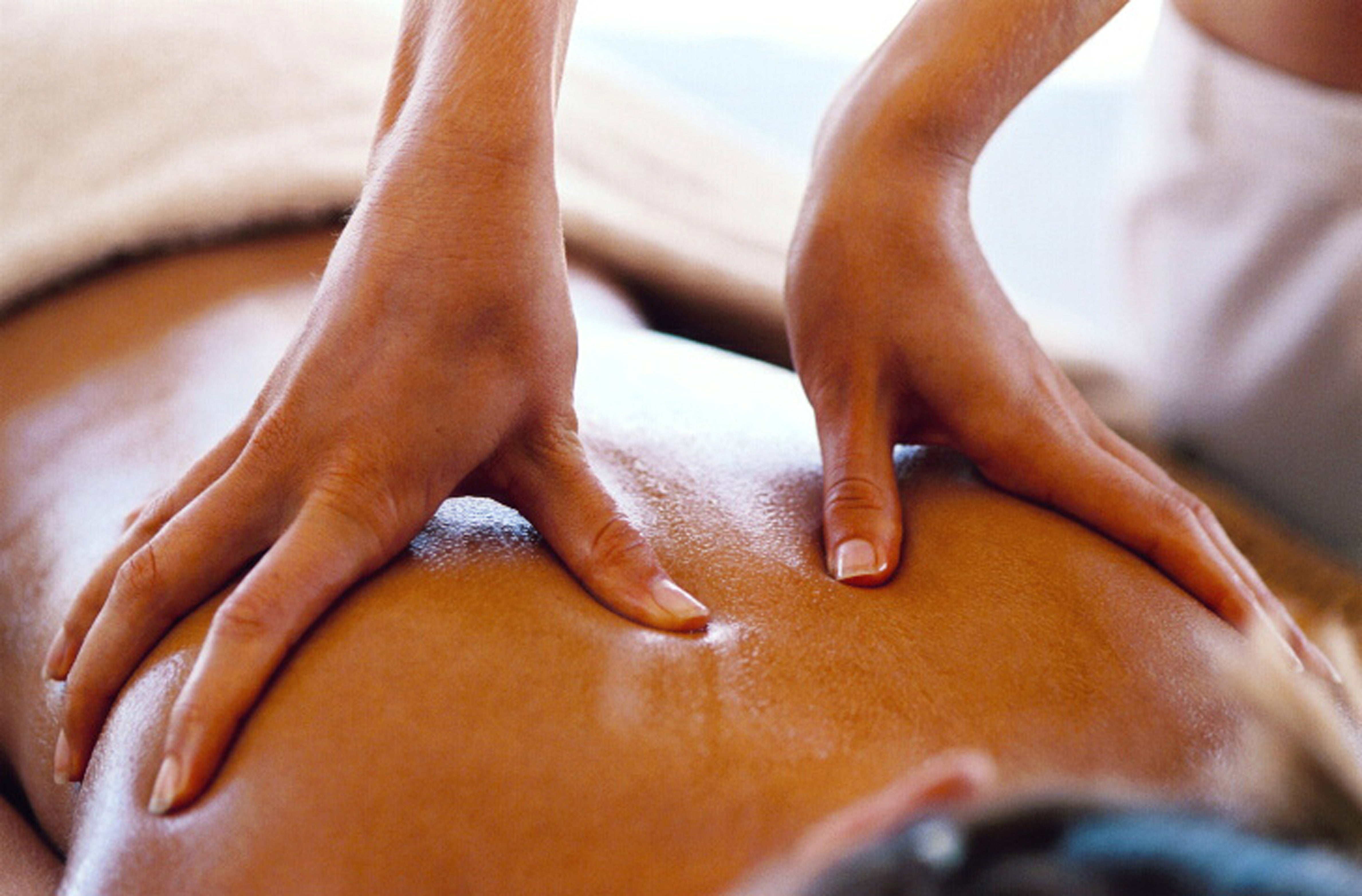 Sensual massage using coconut oil