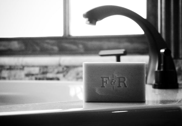 Image of Fulton & Roark bar of soap beside a sink