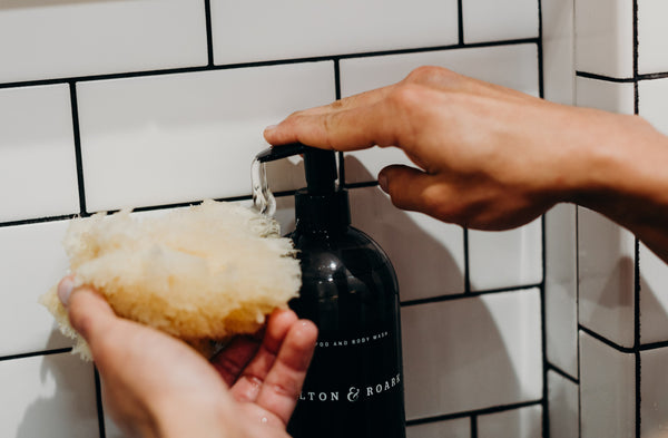 Image of hand pumping out our best-smelling Shampoo + Body Wash