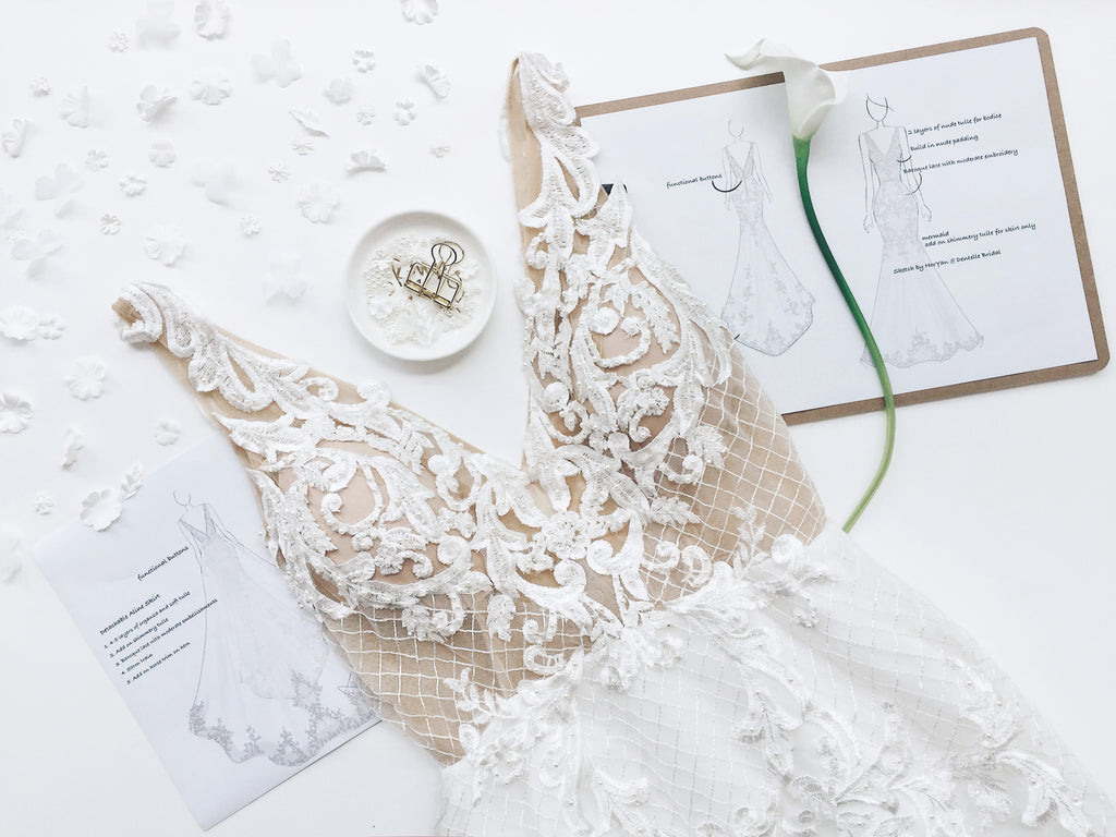 dentelle bridal custom wedding dress flatlay