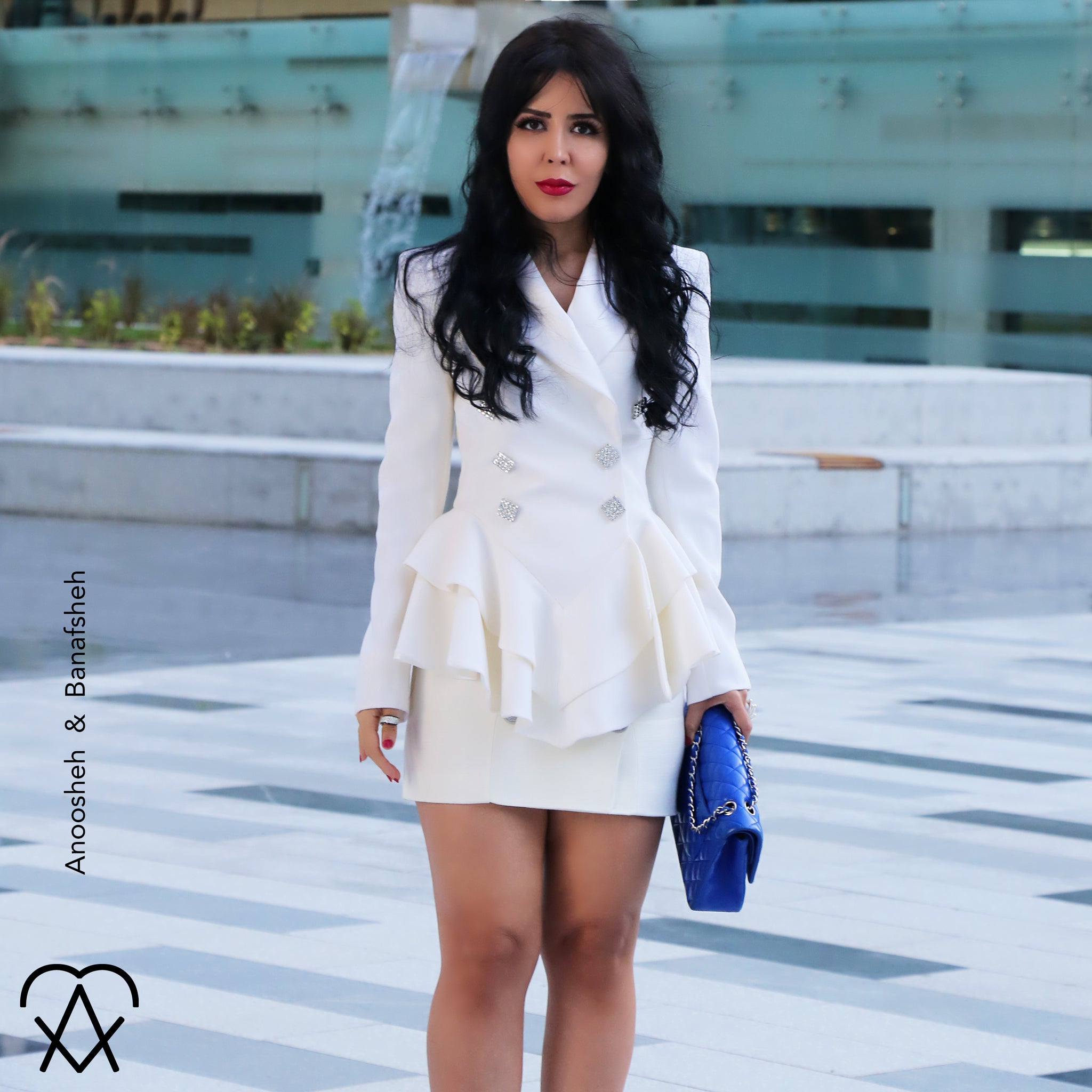Anoosheh & Banafsheh Power of White in style and fashion wearing Alessandra Rich Jacket Balmain Skirt and Chanel Classic Flap Bag in Cobalt Blue