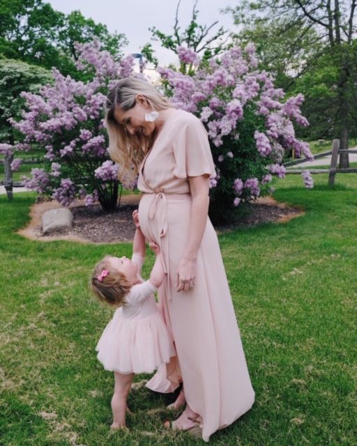 Margot posing outdoors with her daughter