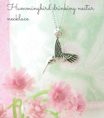 hummingbird drinking nectar necklace