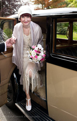 The bride wearing her ivory satin Anna Chocola 1920s cloche hat