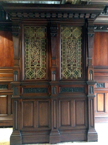 Victorian mahogany panelled room with stained glass