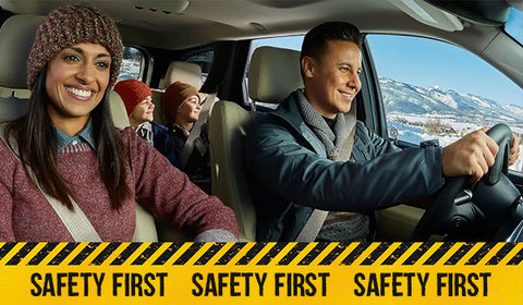 Family In car with safety first caution tape