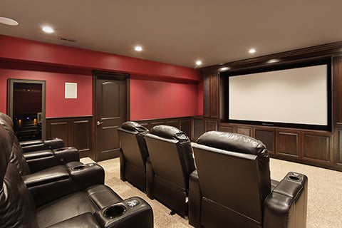 Home Theater with red walls and leather recliners