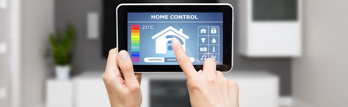 Person controlling home system with tablet