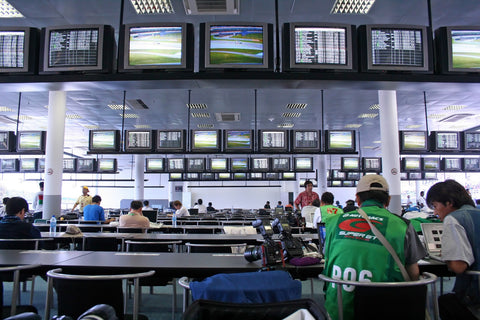 photographers uploading images at a media press office