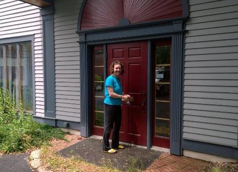 Owner and CEO, Nicole Snow, opening up the front door at 22 North College Street in Schenectady, NY