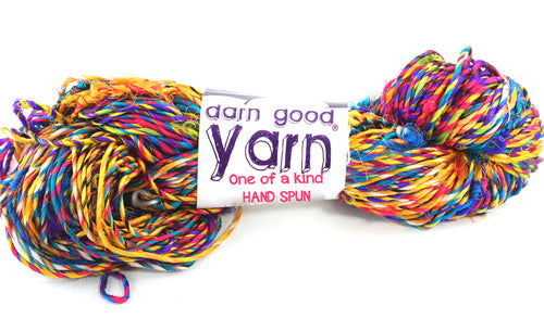 multicolor yarn skein with white label that says darn good yarn