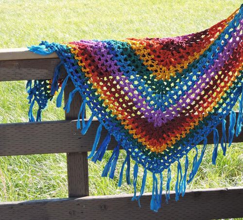 yarn shawl over a fence