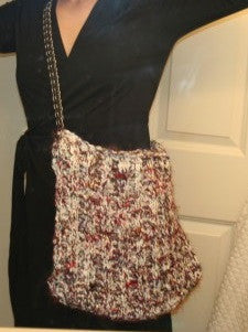 woman wearing yarn hand bag