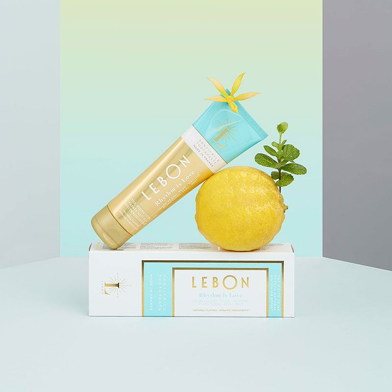 Lebon Rhythm is Love – Ylang Ylang + Yuzu + Mint Organic Toothpaste shown on package with lemon and floral design