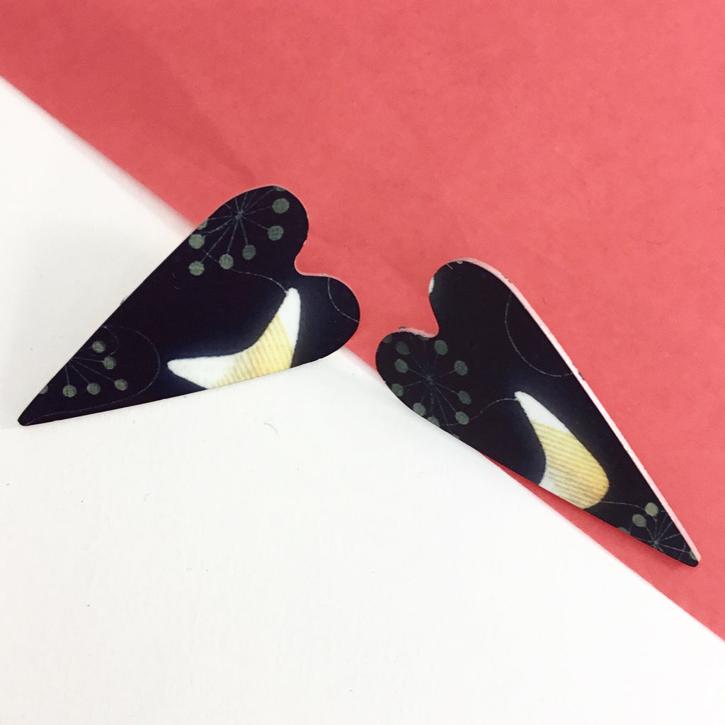 Heart shaped handmade earrings with sterling silver posts. Jewellery handprinted in London.