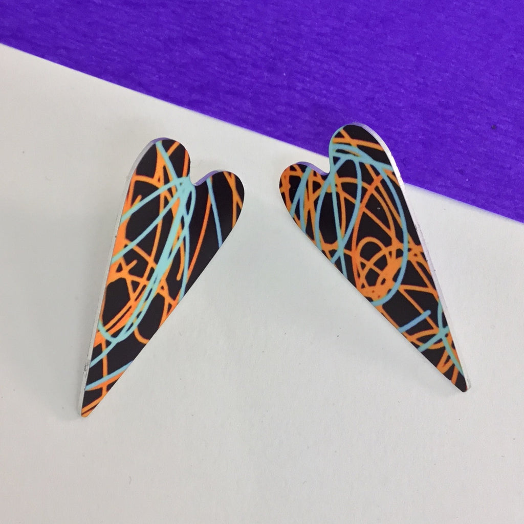 Heart shaped hand printed earrings. Sterling silver posts. Handmade in London
