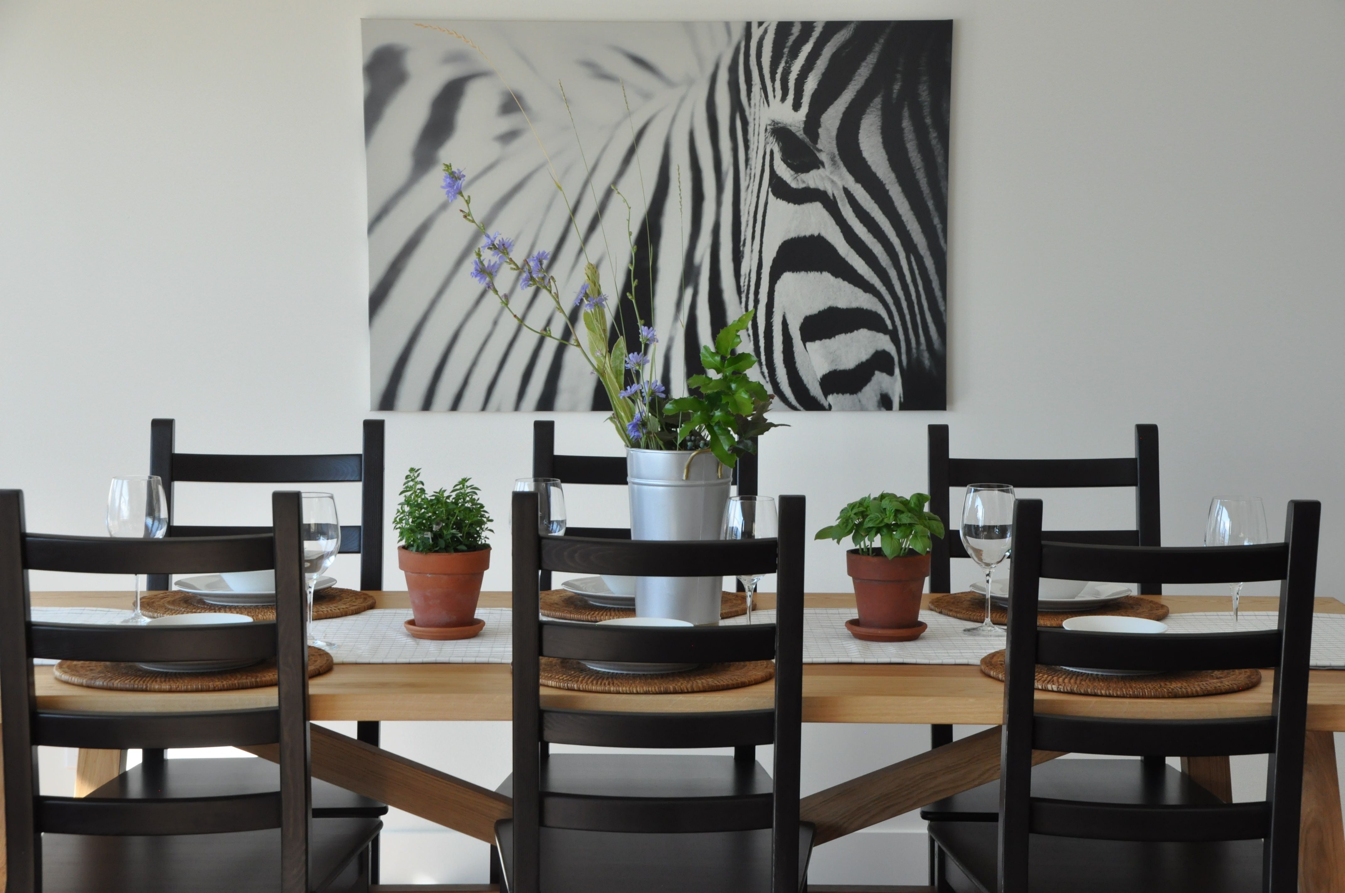 Zebra photo hanging above kitchen table