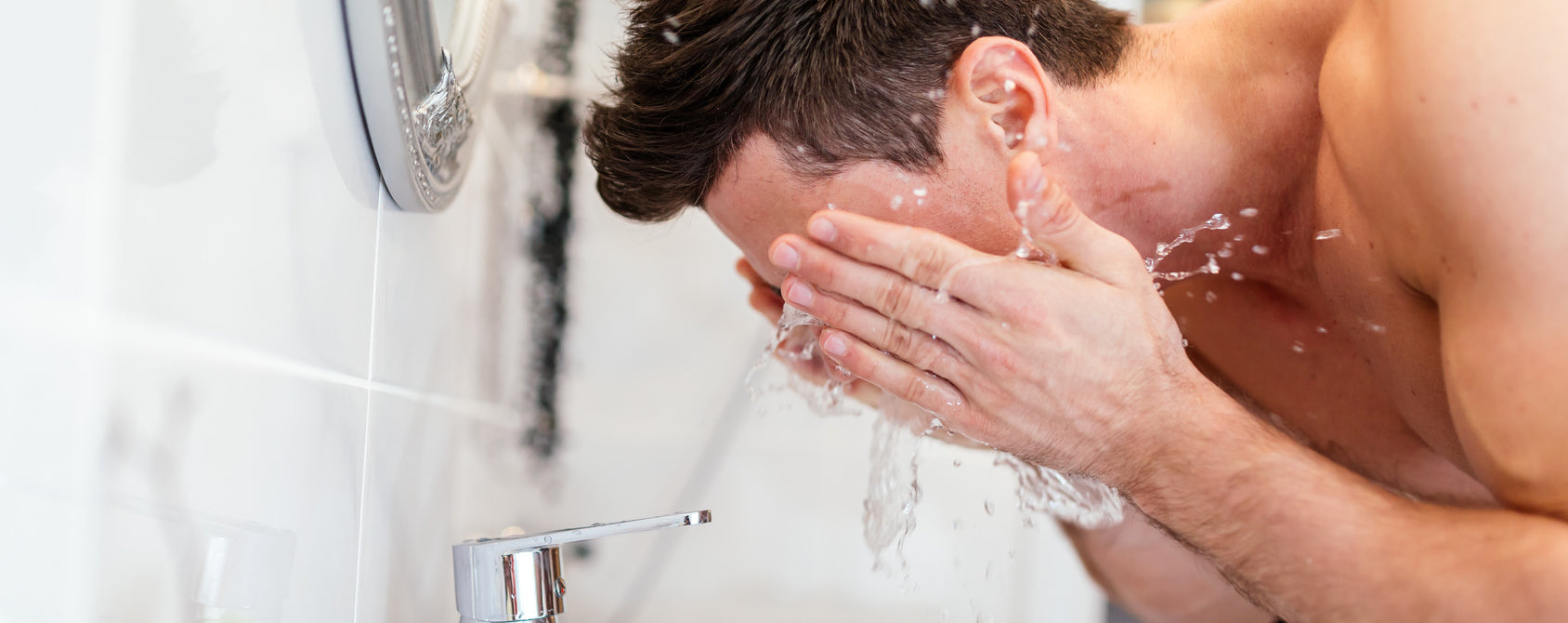 Men's Botanics Skincare - Man Washing Face with Men's Grooming Products