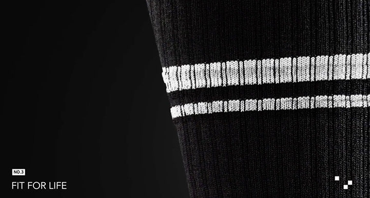 black sock with two white stripes and the words "fit for life"