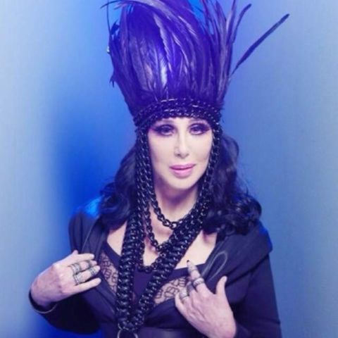 Cher: black feather headdress and harness, Dressed 2 Kill tourbook, promo, and merch