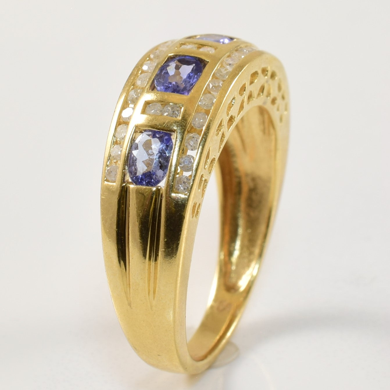 Channel Set Tanzanite & Diamond Ring | 0.68ct, 0.18ctw | SZ 7.75 |