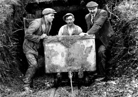 In an age where men don't get dressed up for formal occasions, it's hard to believe they used to wear suits for manual labor.