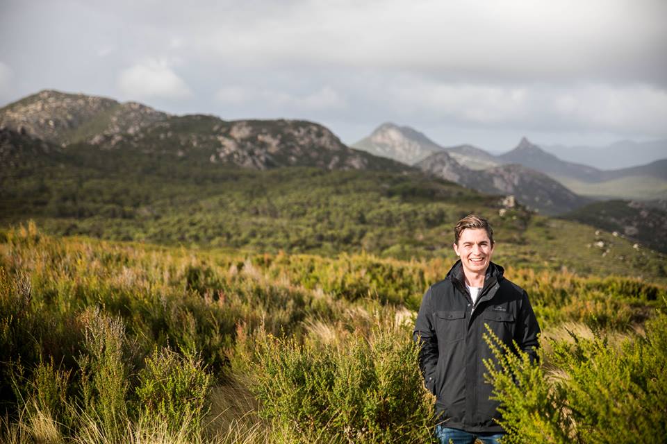 Zea Relief Managing Director, Hayden Brass, surrounded by Tasmanian Kunzea ambigua plants