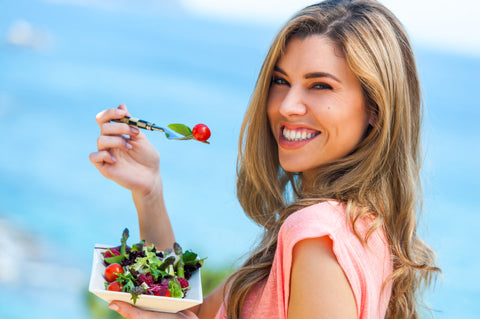 Healthy lifestyle woman eating salad