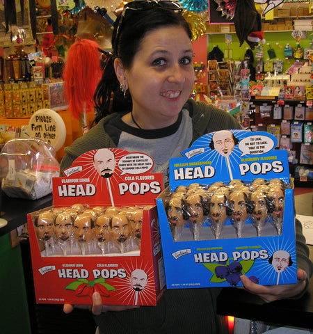 Molly holding Lenin Lollipops and Marie Antionette Head Pops