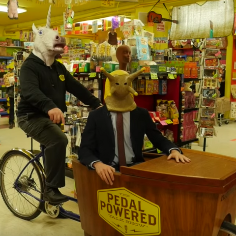 Unicorn and slug pedal powered talk show on bike