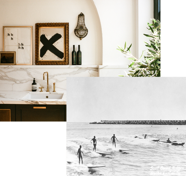 a marble kitchen counter with various pieces of art in antique frames resting above it