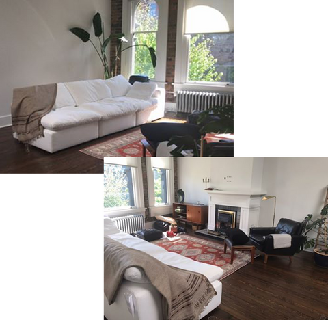 a bright apartment with dark wooden floorboards and a bright white linen sofa. A pink antique rug sits in the centre of the room with a dark leather armchair on one corner