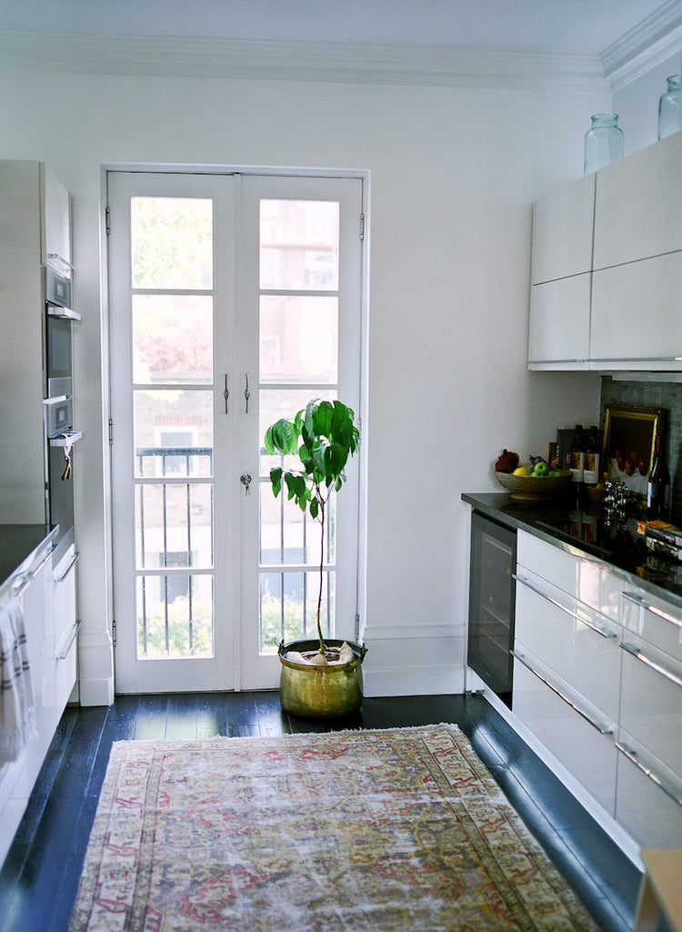 Heather's kitchen in Victorian Notting Hill flat with antique rug