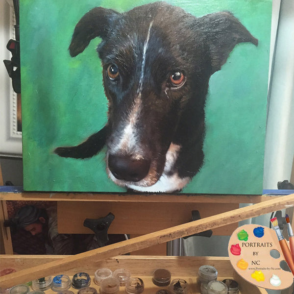 black-dog-painting-on-easel